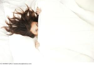 Woman Hiding Under the Covers