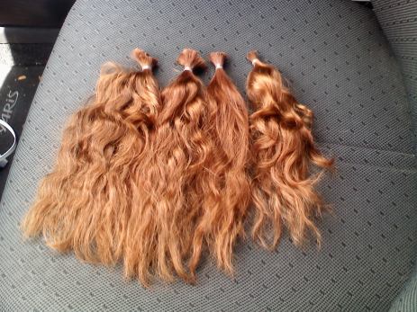 Four small ponytails laid out on the passenger seat of my car on the ride home.