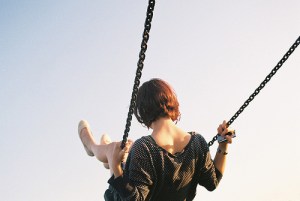 girl on swing back view